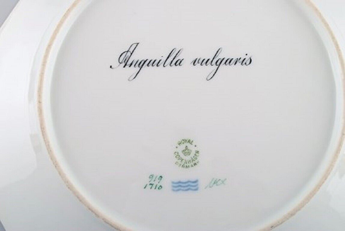 Royal Copenhagen fish plate with green edge gold decoration and fish motif