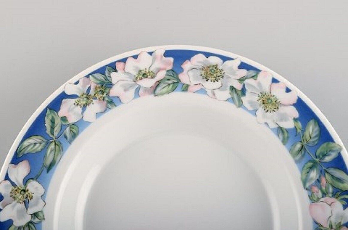 Four Royal Copenhagen White Rose deep plates with blue border white flowers