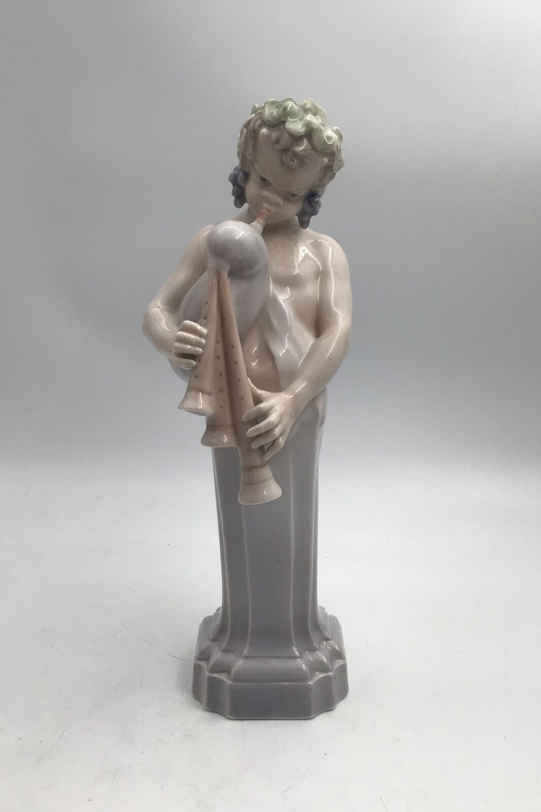 Royal Copenhagen Figurine Dionysus / Bacchus with bagpipe No 2071