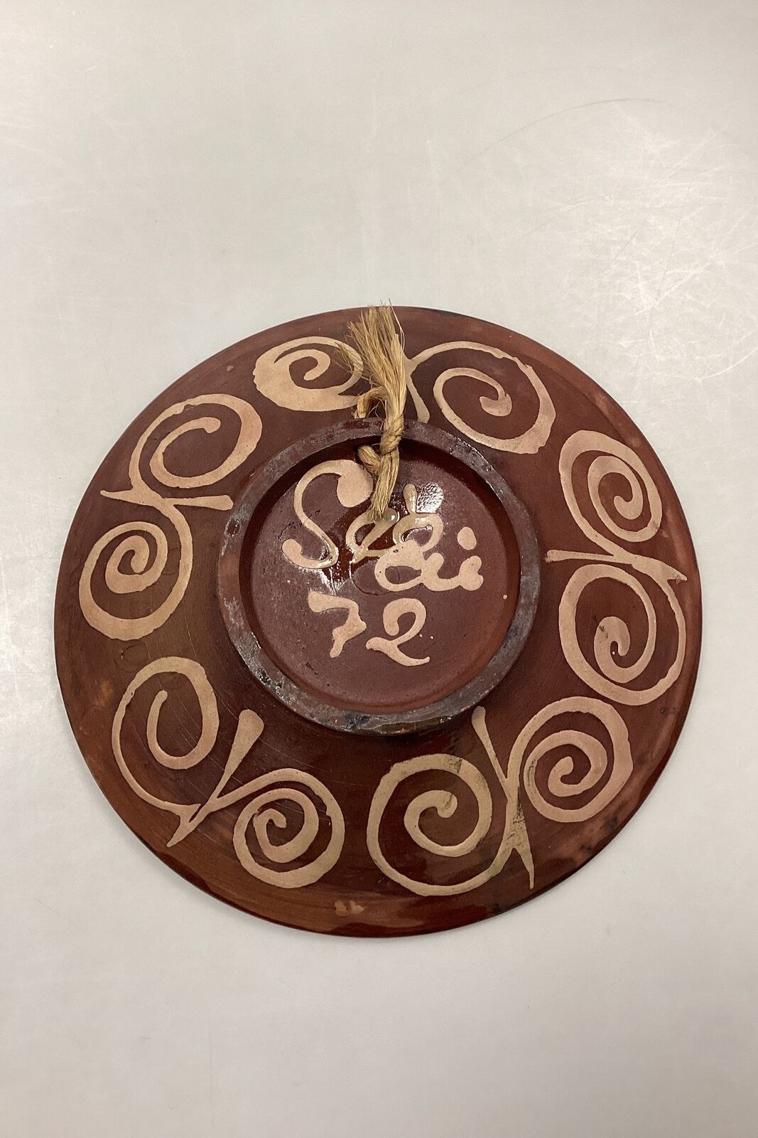 Stoneware bowl in shades of brown yellow and blue