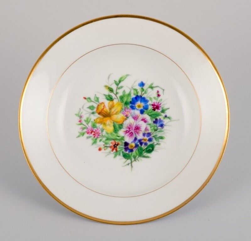 Bing  Grøndahl four deep plates in porcelain with flowers and gold decoration