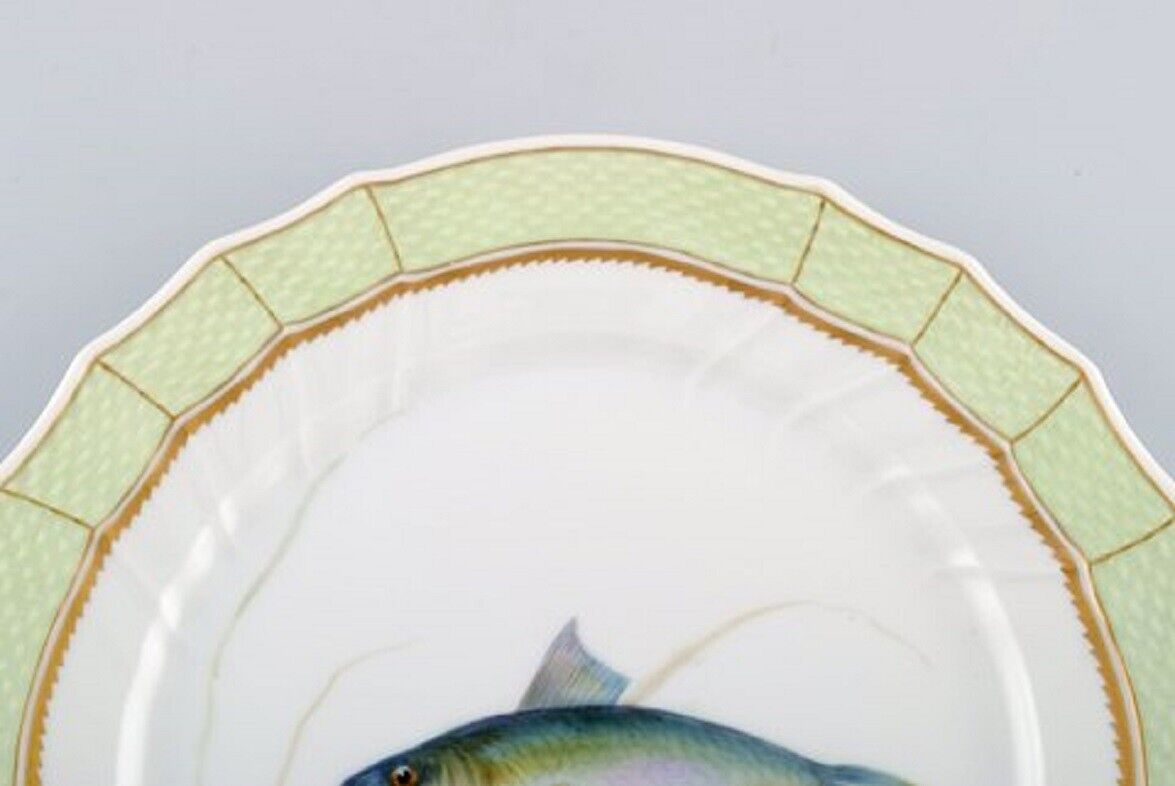 Royal Copenhagen fish plate with green edge gold decoration and fish motif