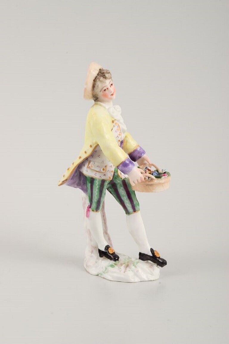 Presumably German porcelain figure man with flower basket 19th century