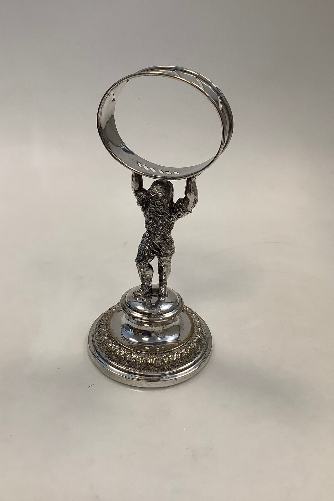 Silver-plated watch holder with a woodsman