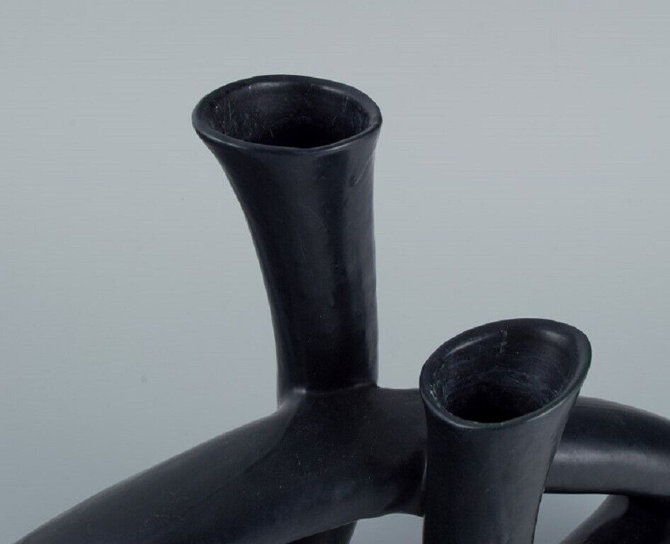 European studio ceramicist Unique twisted vase in black glaze