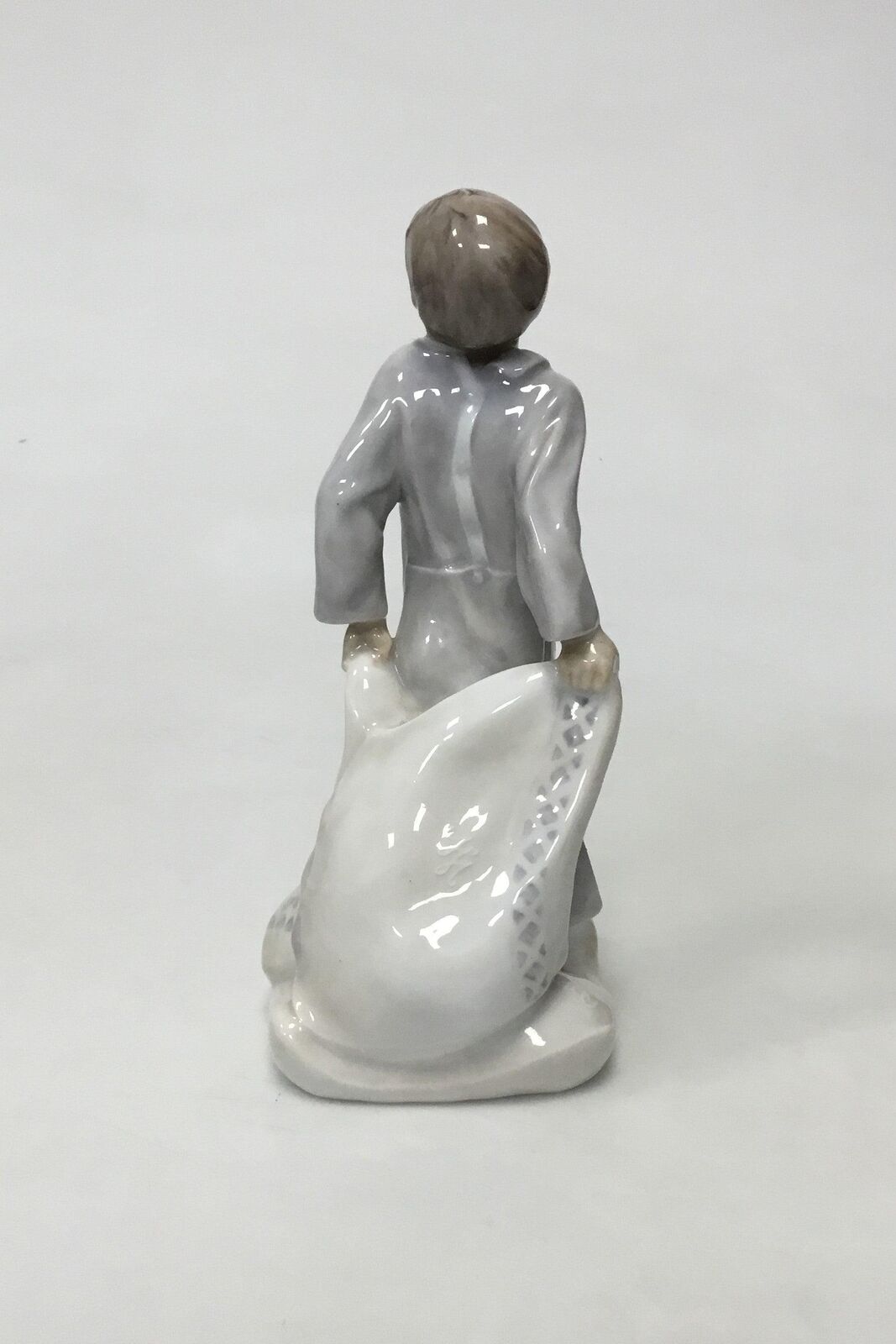 Royal Copenhagen Figurine of Boy with pillows No 2604