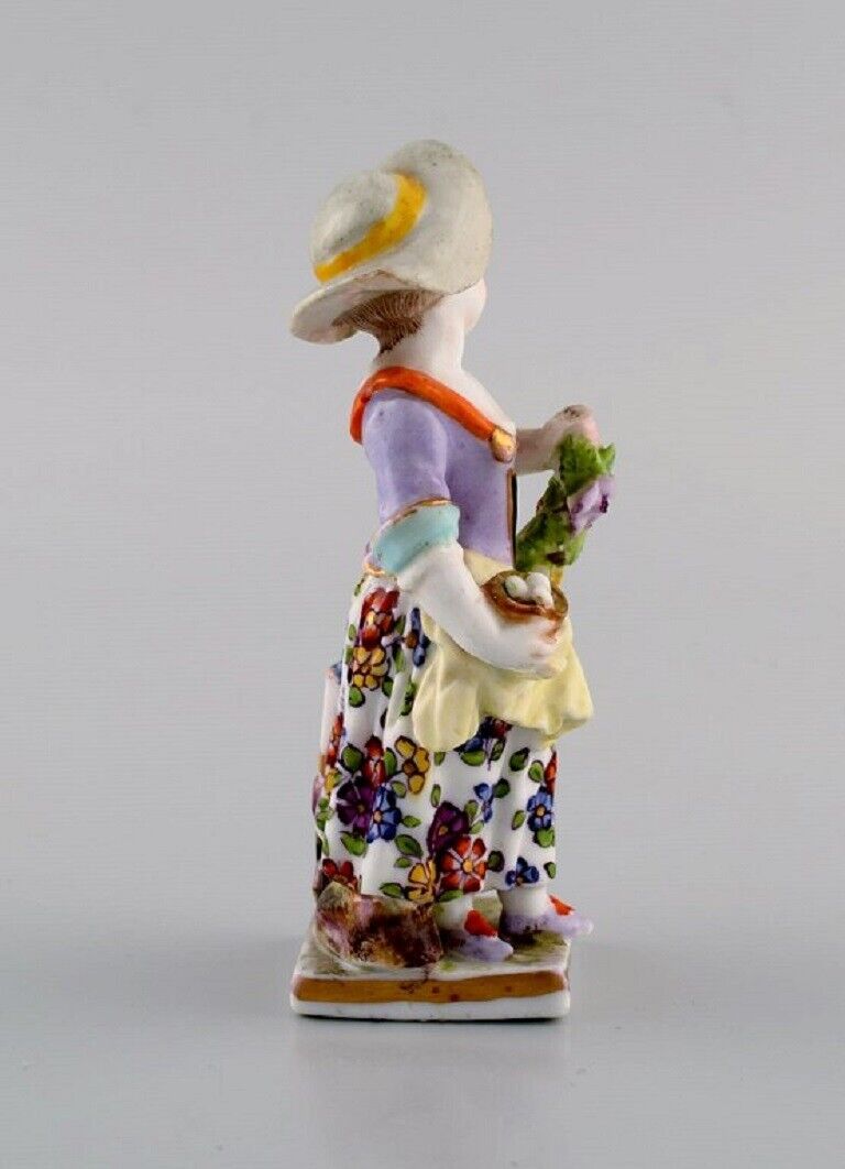 Augustus Rex Germany Antique hand-painted porcelain figure Girl with flowers