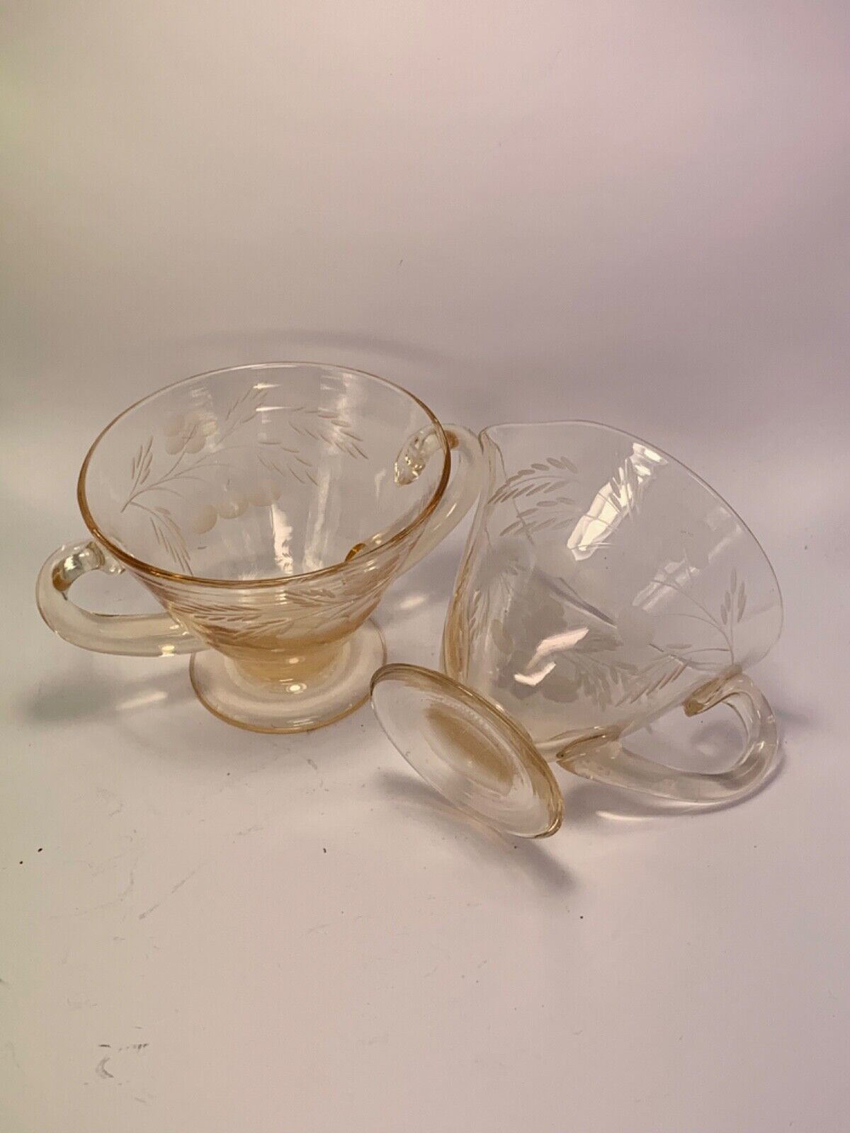 Vintage orange depression glass creamer  sugar bowl set with floral engraving