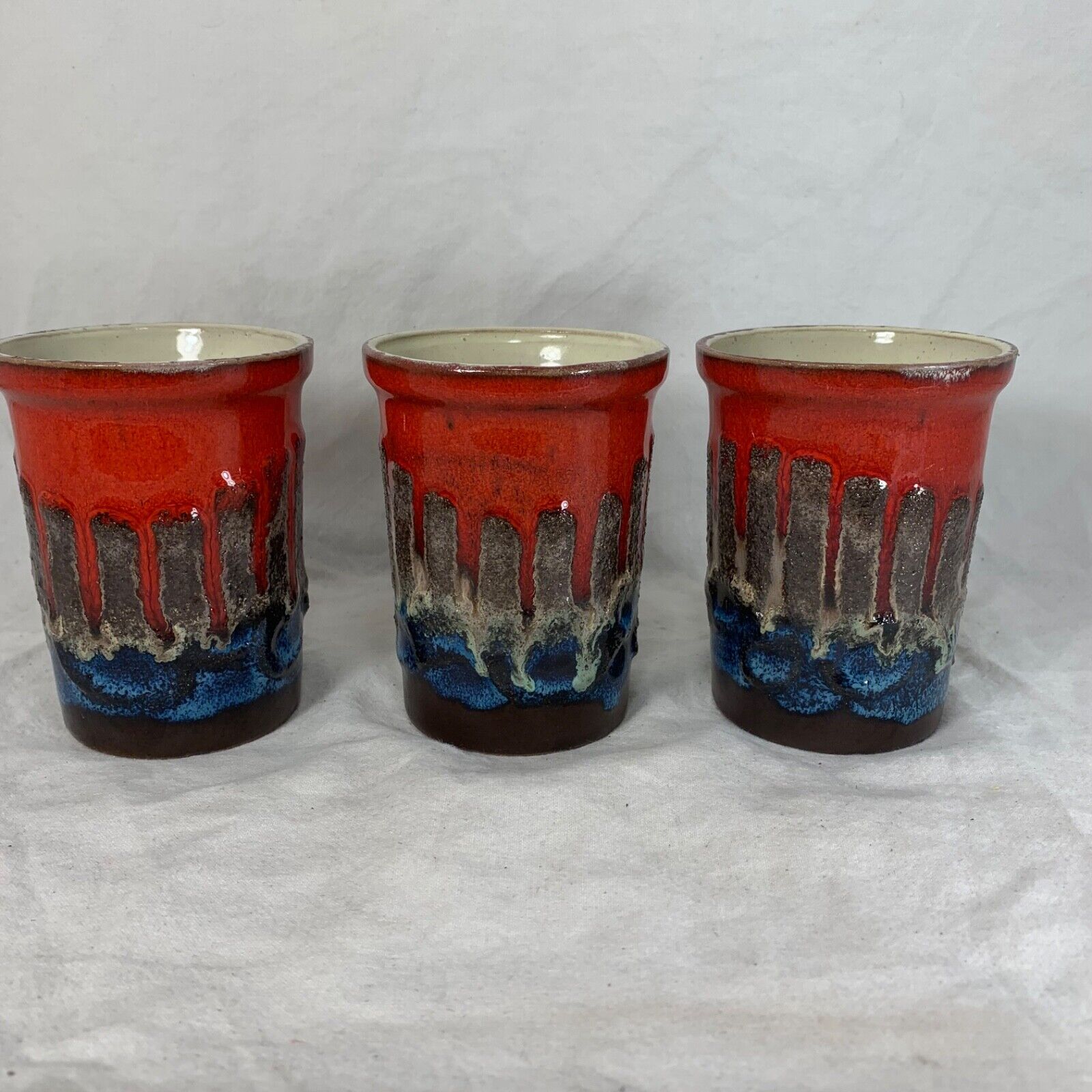Vintage Strehla fat lava ceramic pitcher and cups red blue Germany