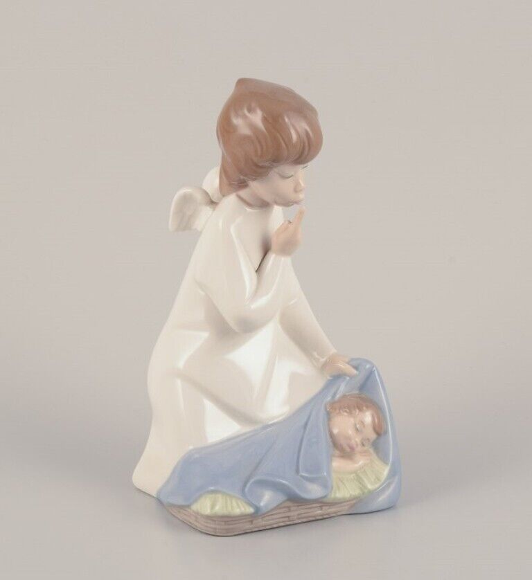 Lladro Spain Two porcelain figurines Girl with a nightstand lamp and an angel