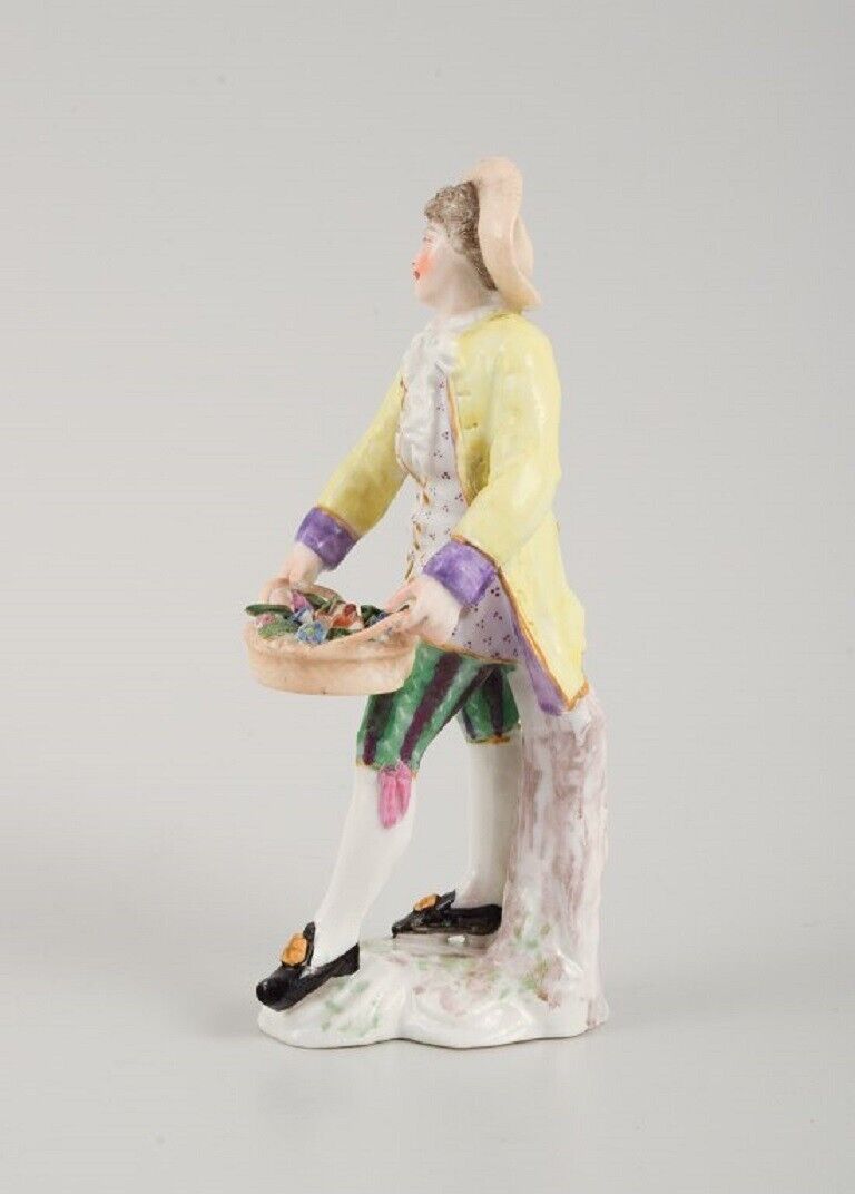 Presumably German porcelain figure man with flower basket 19th century