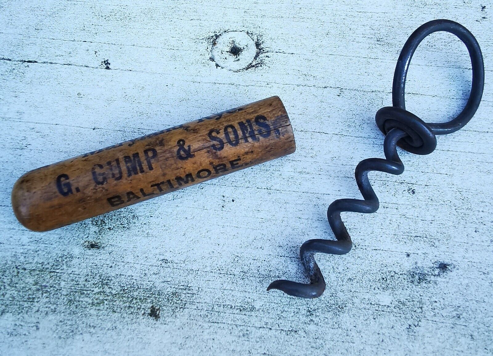 G Gump  Son Whiskey Baltimore metal corkscrew with wooden cap c 1910