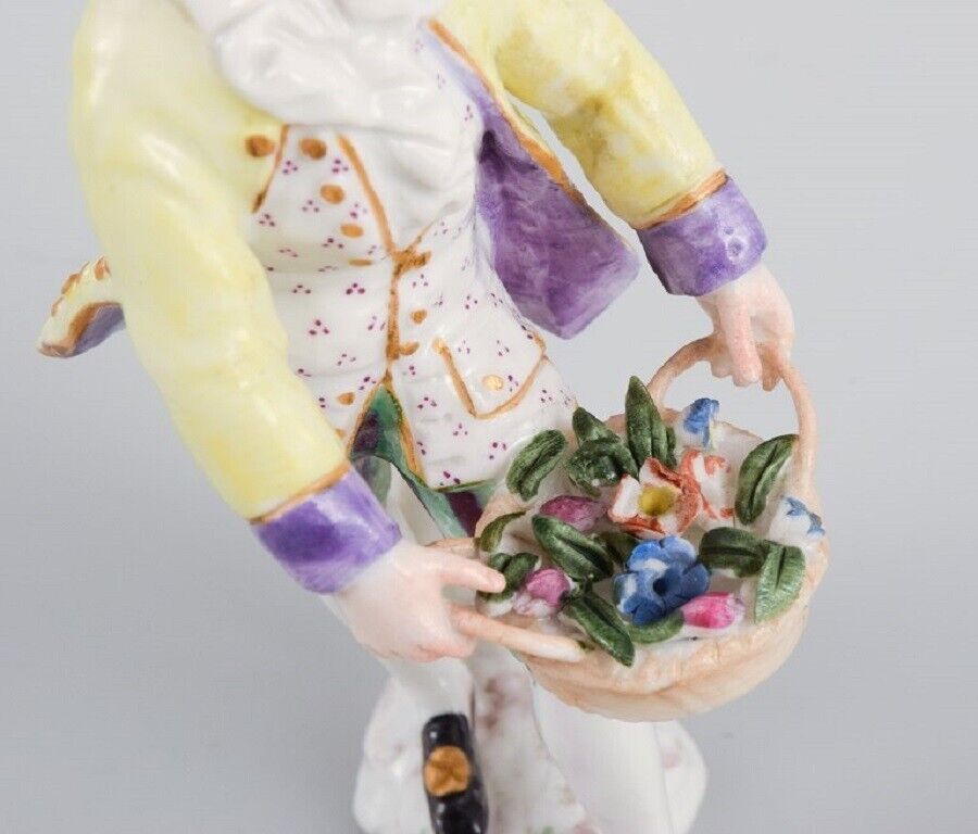 Presumably German porcelain figure man with flower basket 19th century