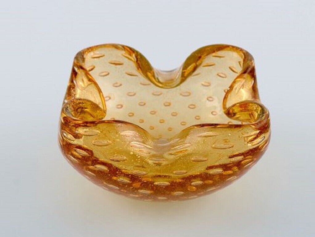 Murano bowl in amber colored mouth-blown art glass with inlaid air bubbles