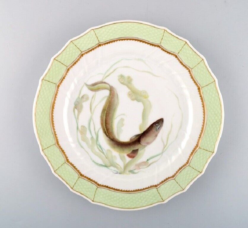 Royal Copenhagen fish plate with green edge gold decoration and fish motif