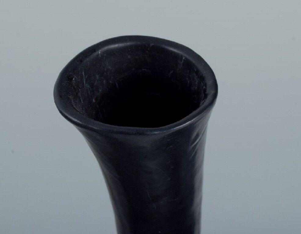 European studio ceramicist Unique twisted vase in black glaze