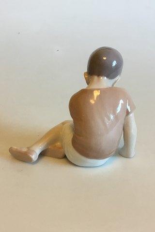 Bing  Grondahl Figurine of Boy sitting looking down No 1671