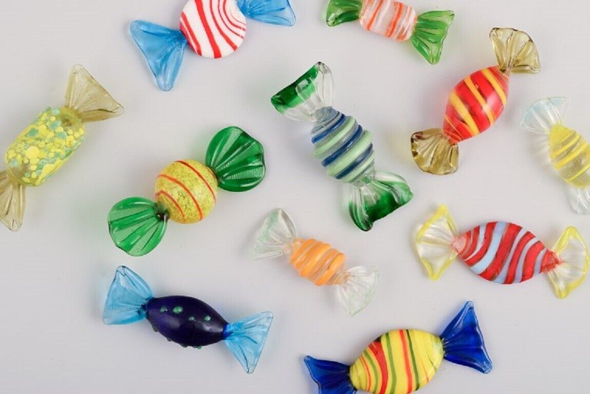 A collection of eleven pieces Murano art glass colorful striped bonbons