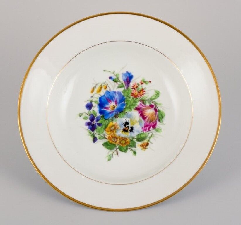 Bing  Grøndahl eight deep plates in porcelain with flowers and gold decoration