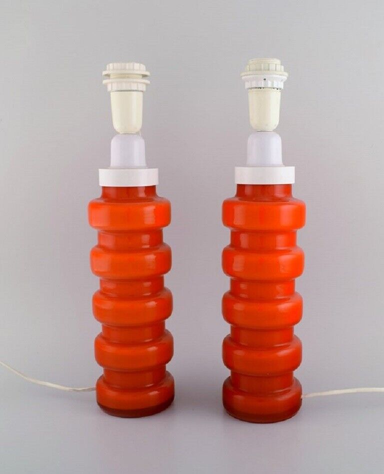 PO Ström for Alsterfors Two table lamps in orange mouth blown art glass