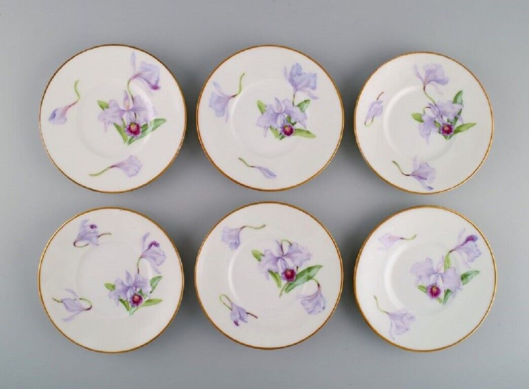 Twelve antique unique Royal Copenhagen porcelain plates with iris flowers