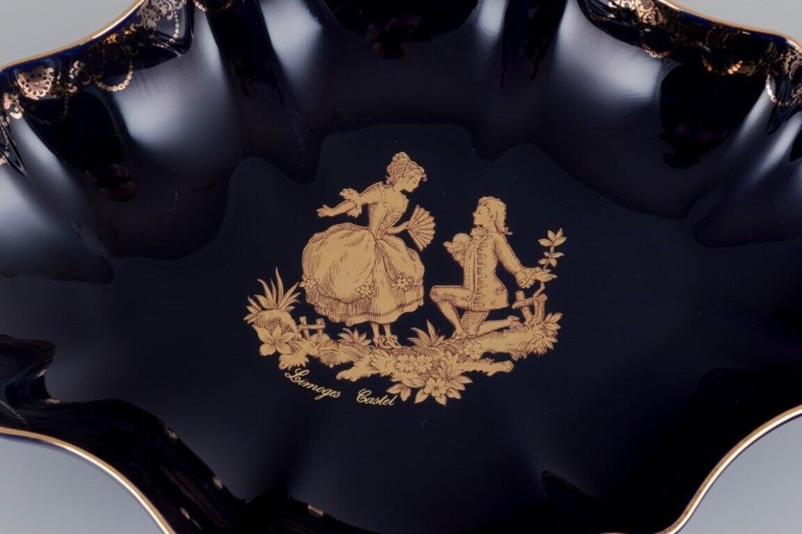 Limoges France Two porcelain serving platters adorned with 22-karat gold leaf