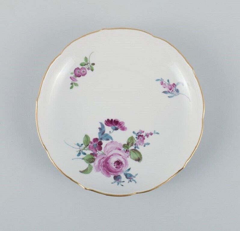 Six antique Meissen plates hand painted with polychrome flowers and gold edge