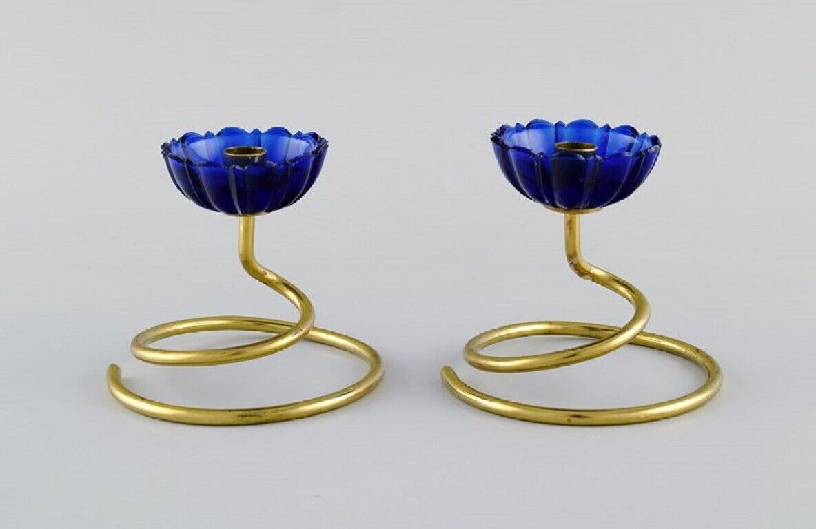 Gunnar Ander for Ystad Metall Two candlesticks in brass and blue art glass