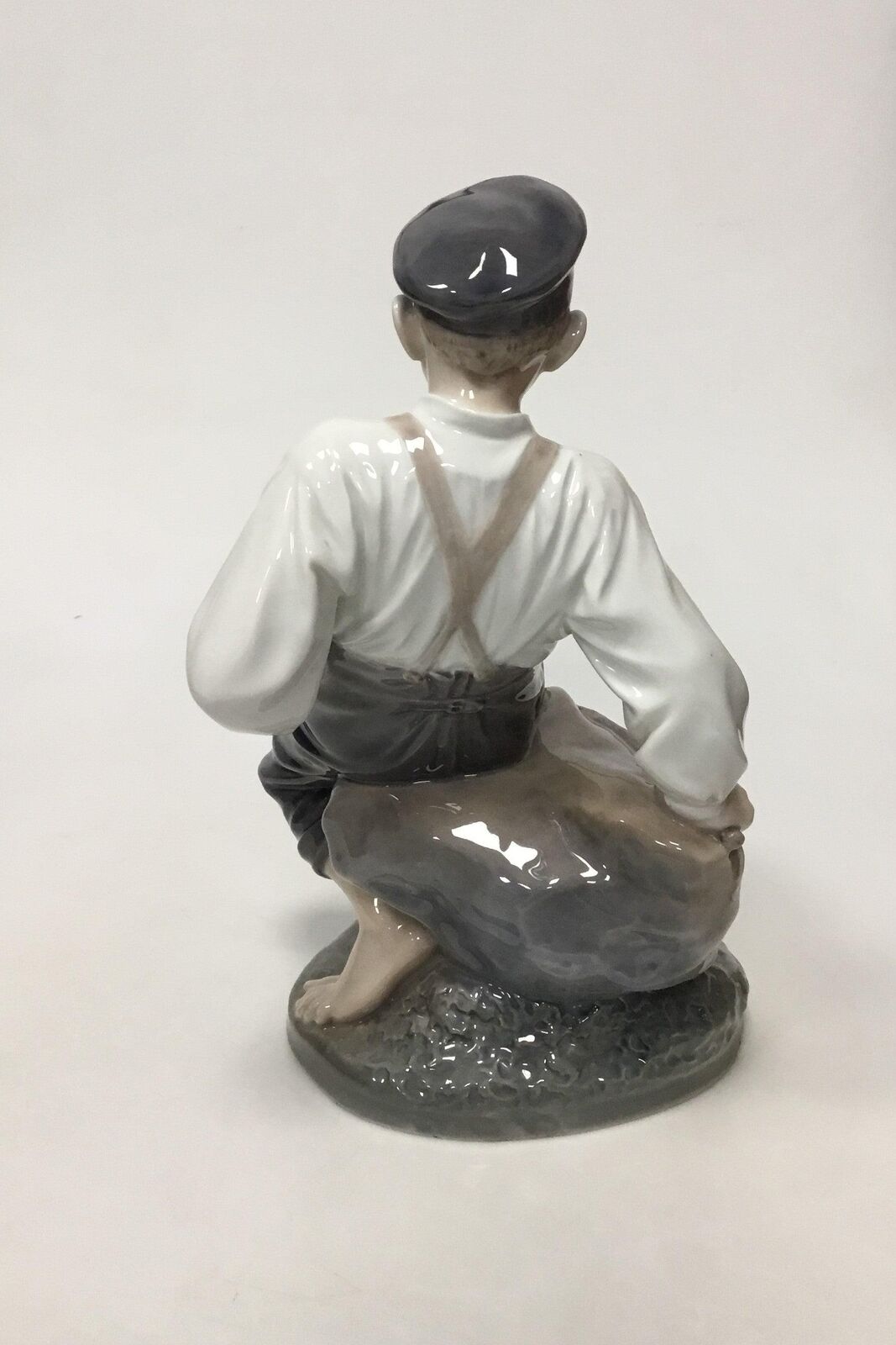 Royal Copenhagen Figurine Boy on Rock No 1659