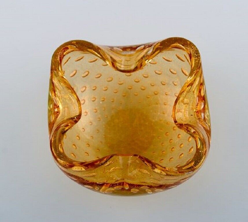 Murano bowl in amber colored mouth-blown art glass with inlaid air bubbles