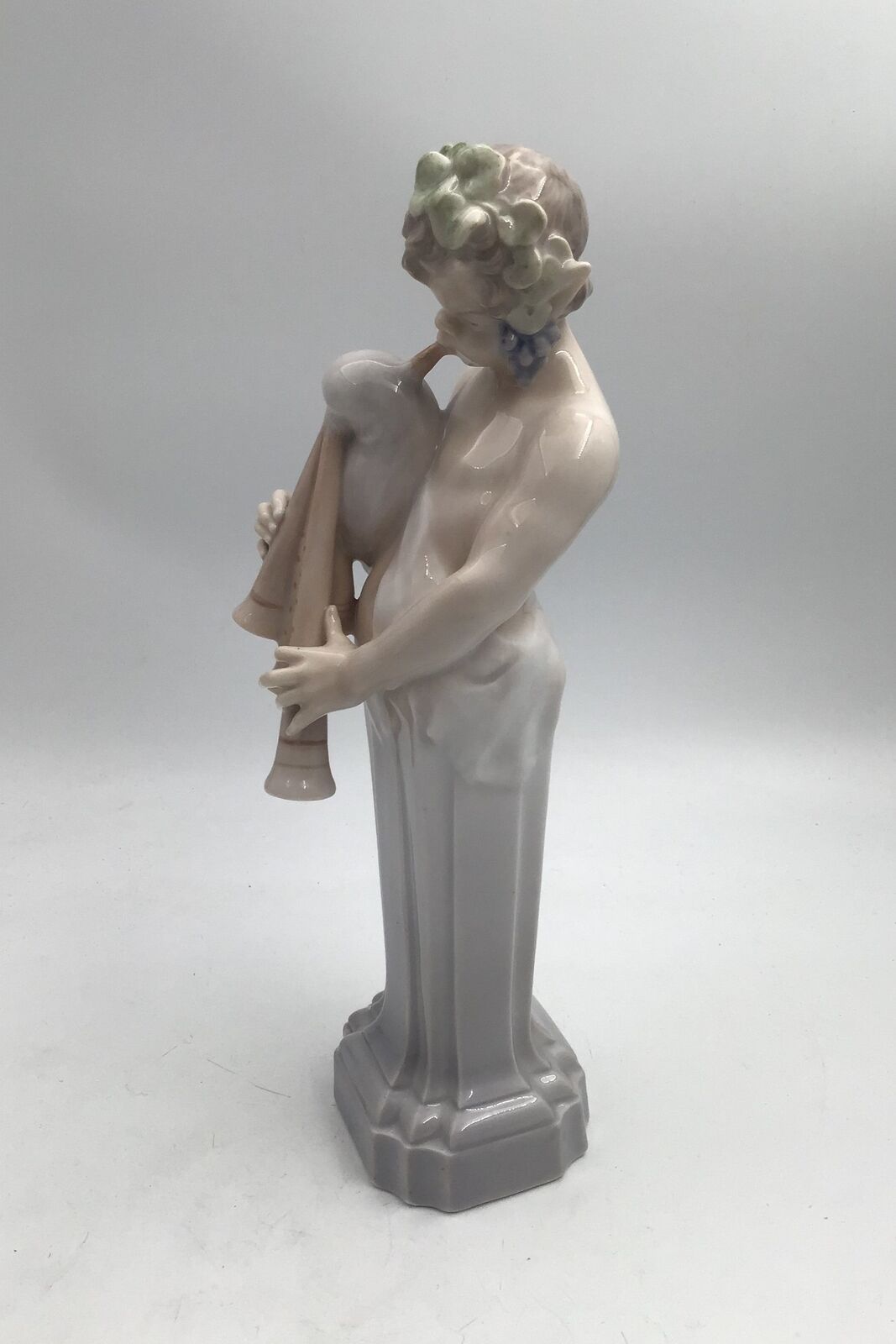 Royal Copenhagen Figurine Dionysus / Bacchus with bagpipe No 2071
