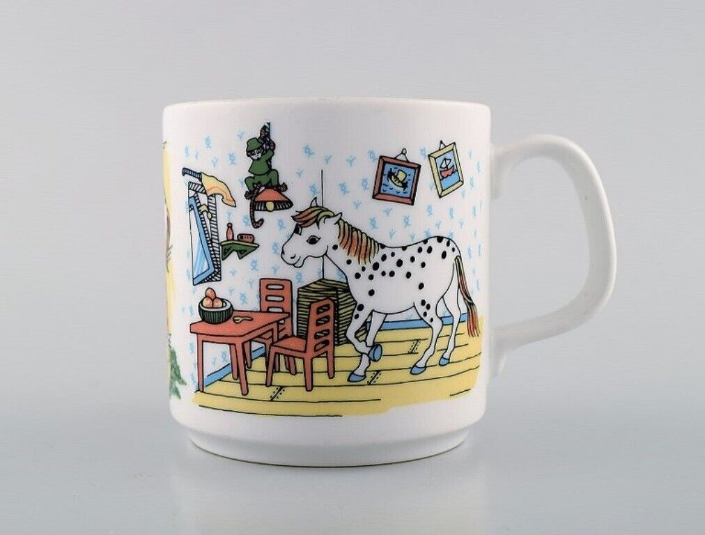 Rörstrand Four cups and a plate in porcelain with Pippi Longstocking motifs