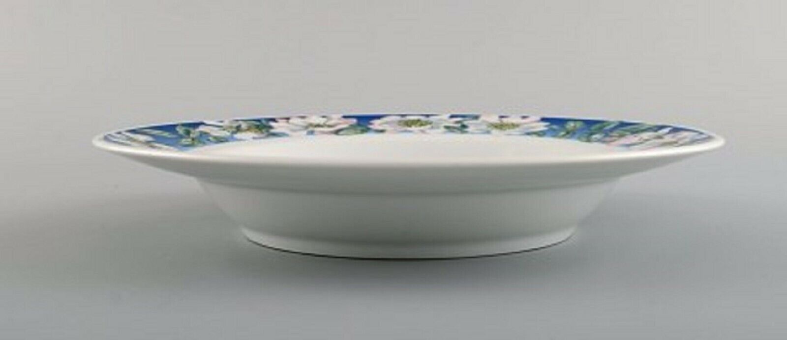 Four Royal Copenhagen White Rose deep plates with blue border white flowers