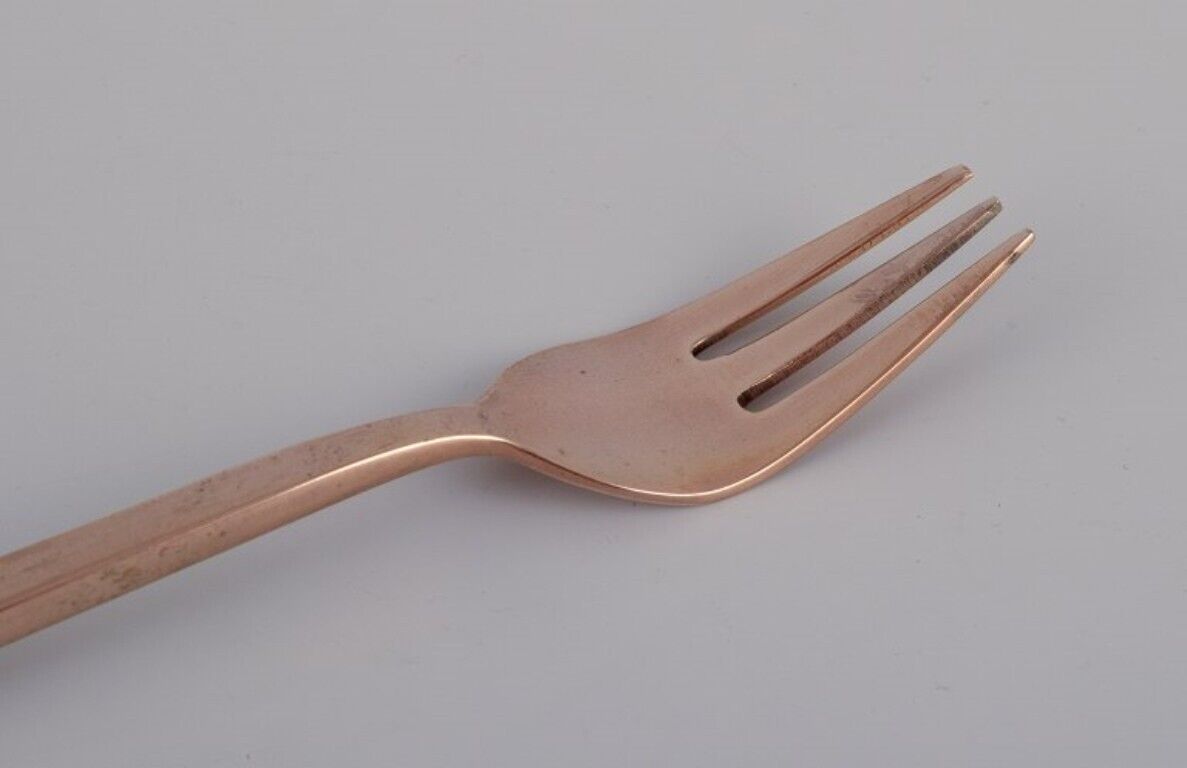 Sigvard Bernadotte 'Scanline' cutlery set in brass Eight cake forks