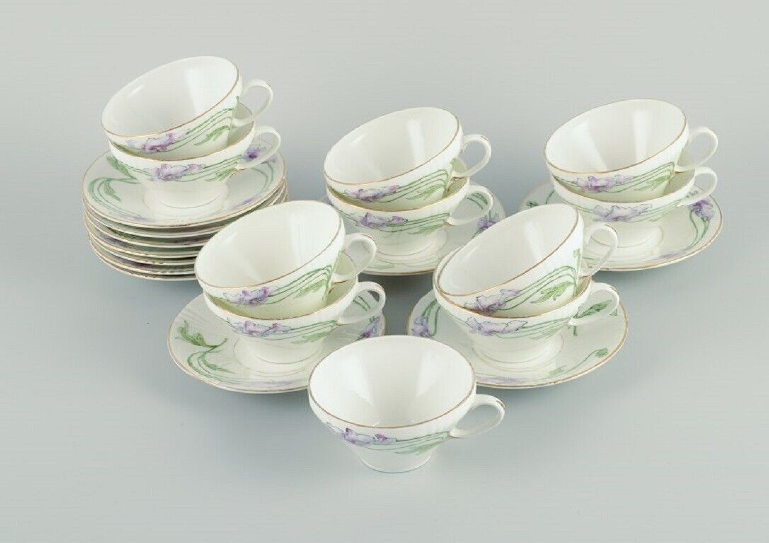 Rörstrand Sweden A set of eleven Art Nouveau porcelain teacups with saucers