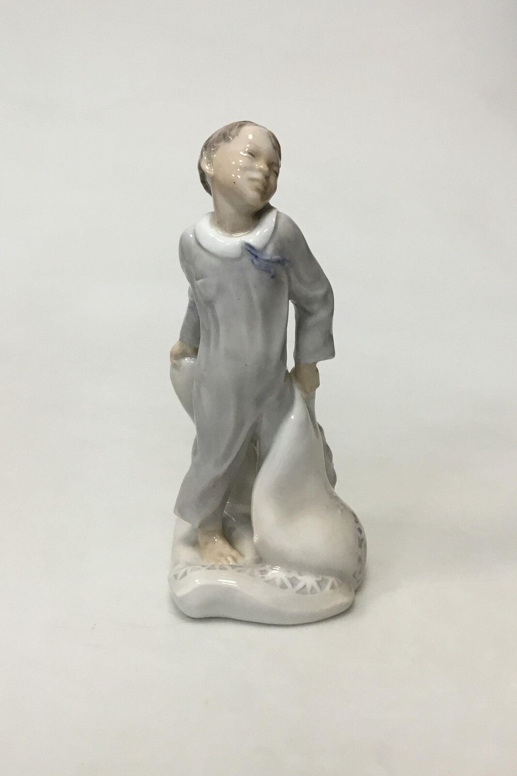 Royal Copenhagen Figurine of Boy with pillows No 2604