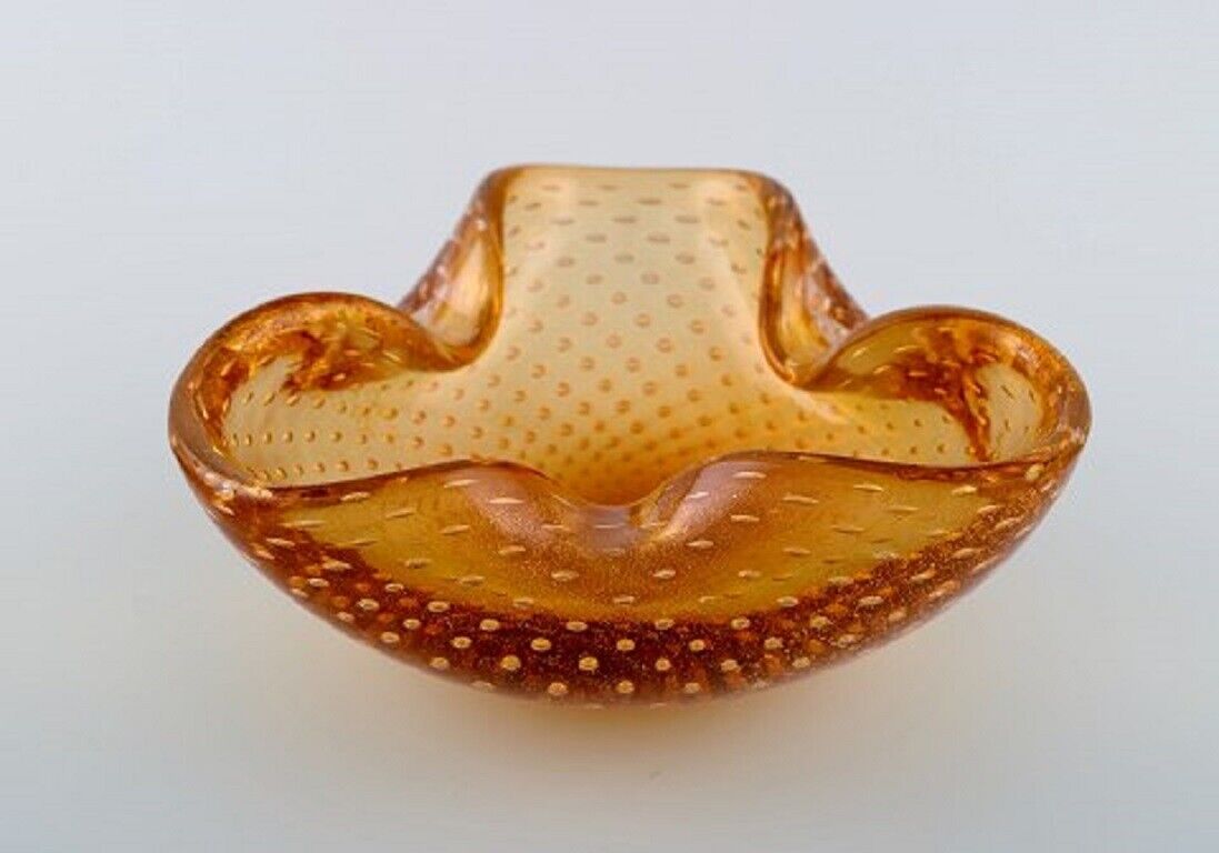 Murano bowl in amber colored mouth-blown art glass with inlaid air bubbles