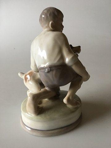 Royal Copenhagen Figurine of Boy with dog No 2140