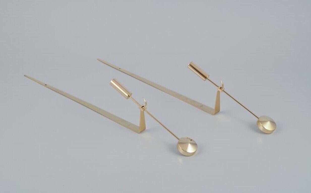 Skultuna A pair of wall-mounted candle holders in brass