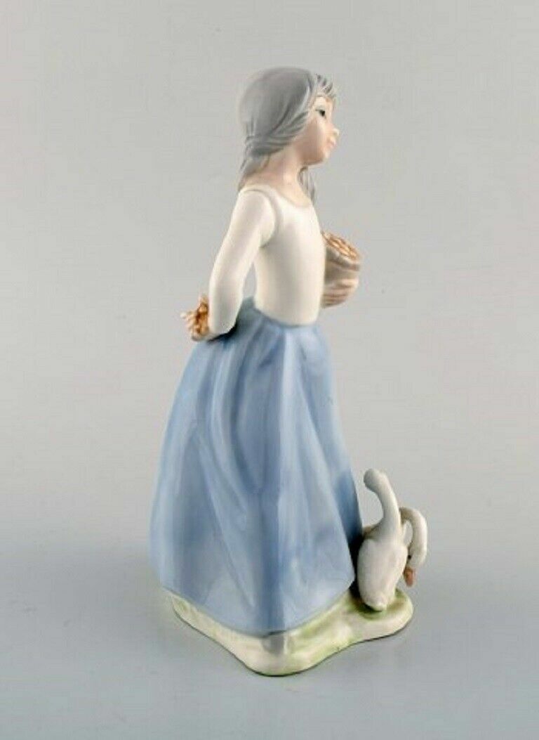 Lladro Tengra and Zaphir Spain Four porcelain figurines of children