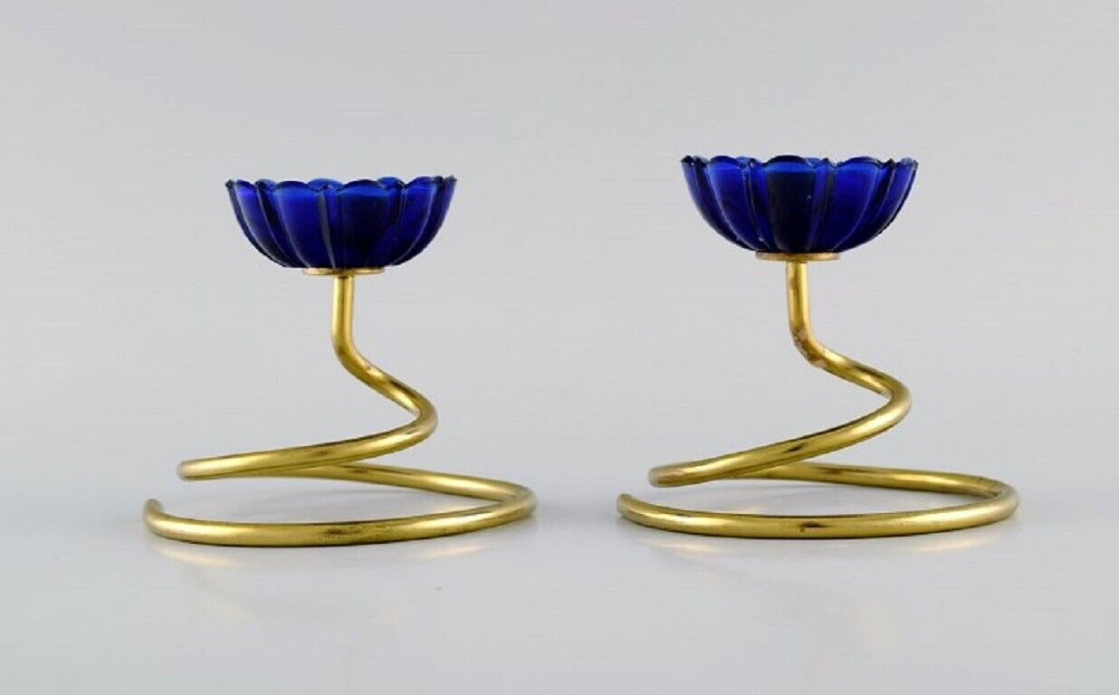 Gunnar Ander for Ystad Metall Two candlesticks in brass and blue art glass