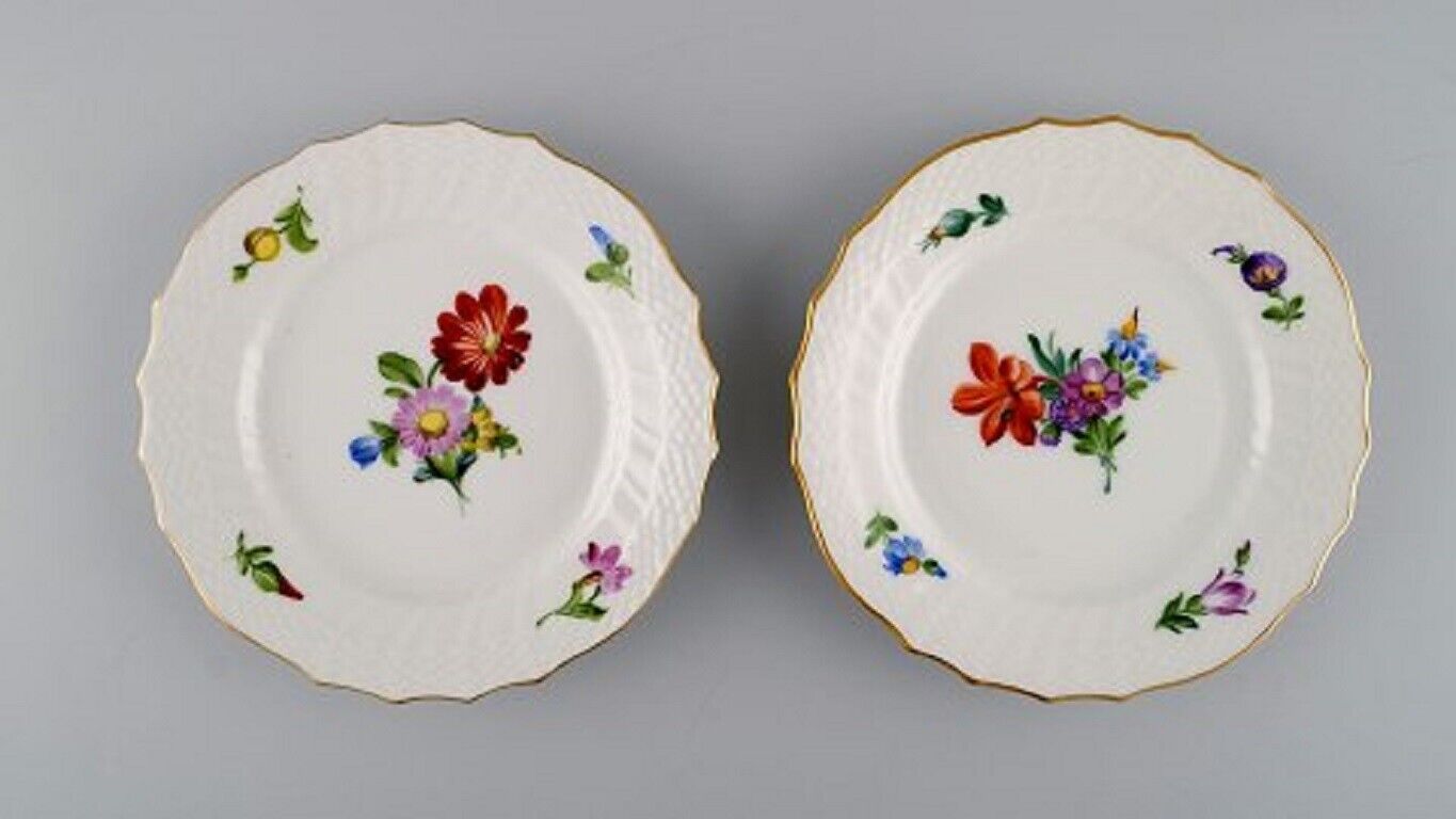 Two Royal Copenhagen Saxon Flower coffee cups with saucers and two plates