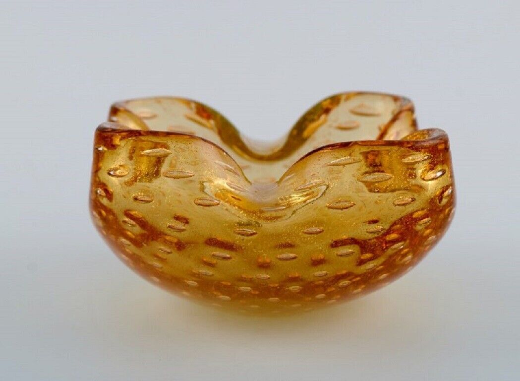 Murano bowl in amber colored mouth-blown art glass with inlaid air bubbles