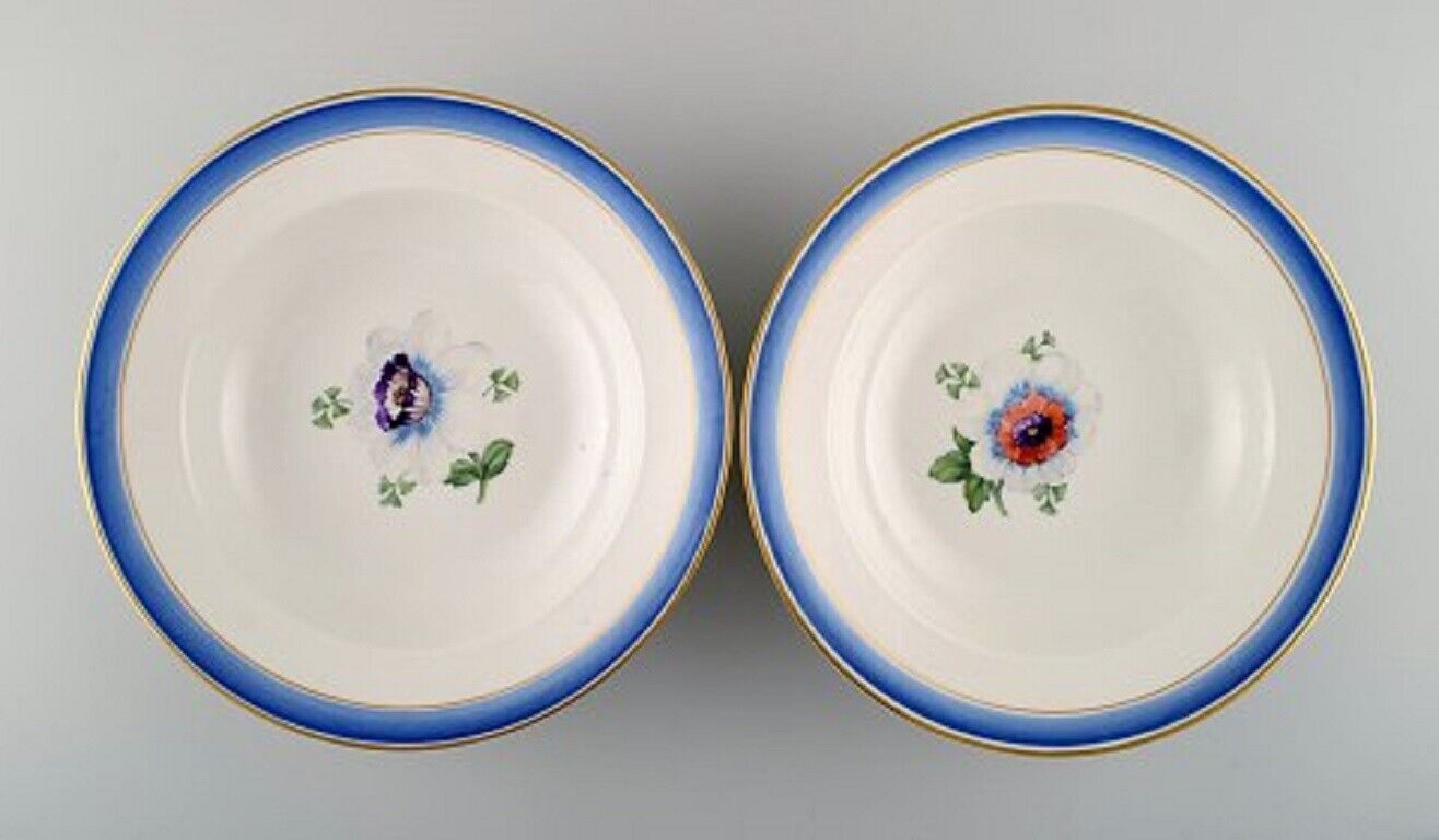 Four antique Royal Copenhagen deep plates in hand-painted porcelain