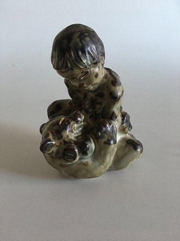 Royal Copenhagen Stoneware Figurine of a child with a bear No 20245