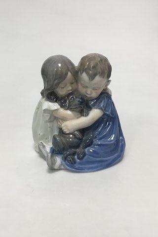 Royal Copenhagen Figurine of children with dachshund No 707/070 from 1992-1999