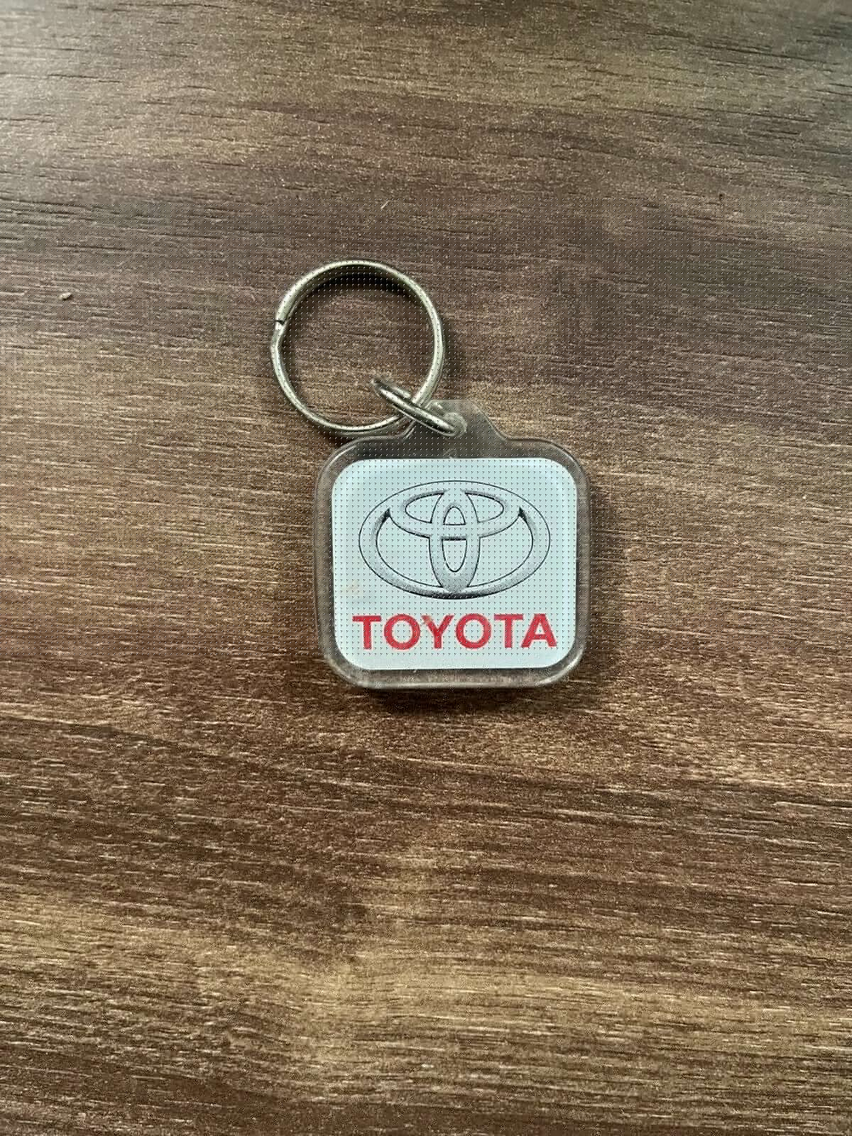 Vintage Toyota Nissan Danish Plastic Keychain Car Dealership Retro Design