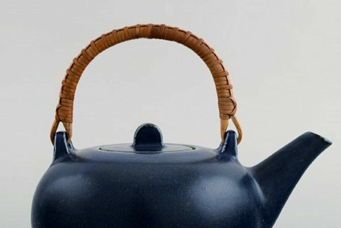 Eva Stæhr-Nielsen for Saxbo Teapot in glazed ceramics with handle in wicker