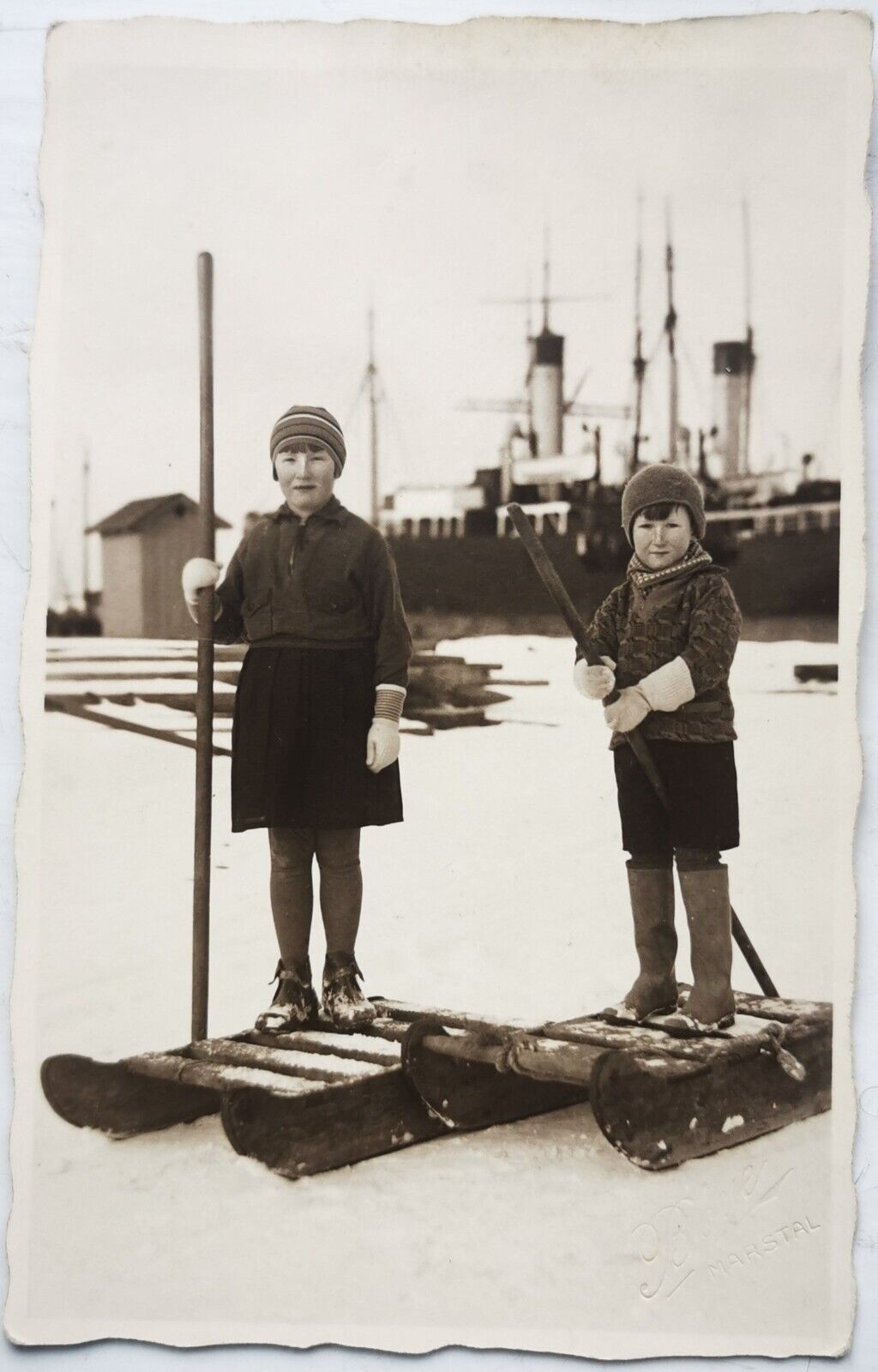 Old photo postcard: Children on sleds on the ice in the harbor c 1920  pok1188