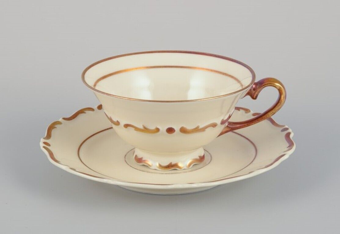 Set of five KP Karlskrona tea cups with saucers and a creamer in porcelain